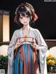 A woman in a kimono standing in front of a building.